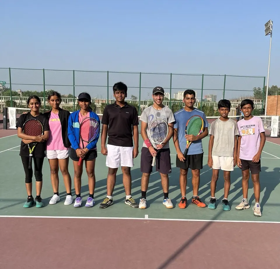 PLAY n FIT Professional Group players standing together on a tennis court